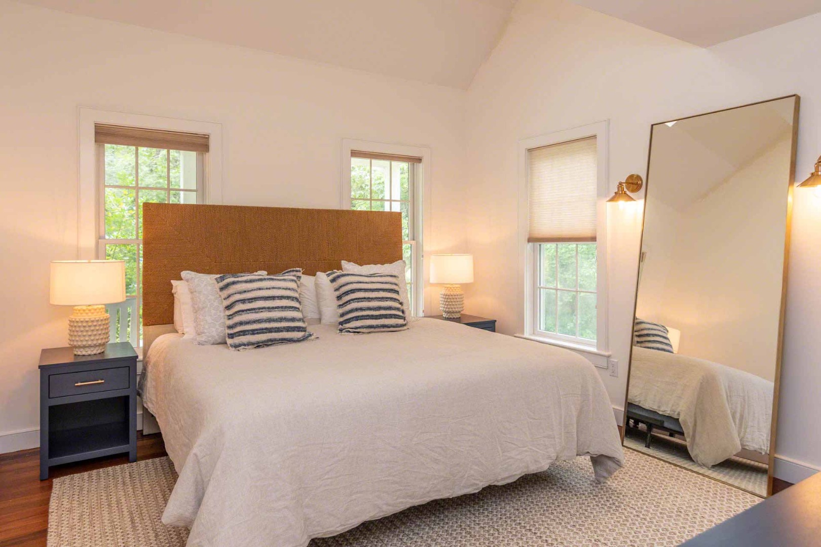 29 Pradas Way Edgartown, MA 02539 - Photo 13 of 30 a bedroom with a bed and wooden floor