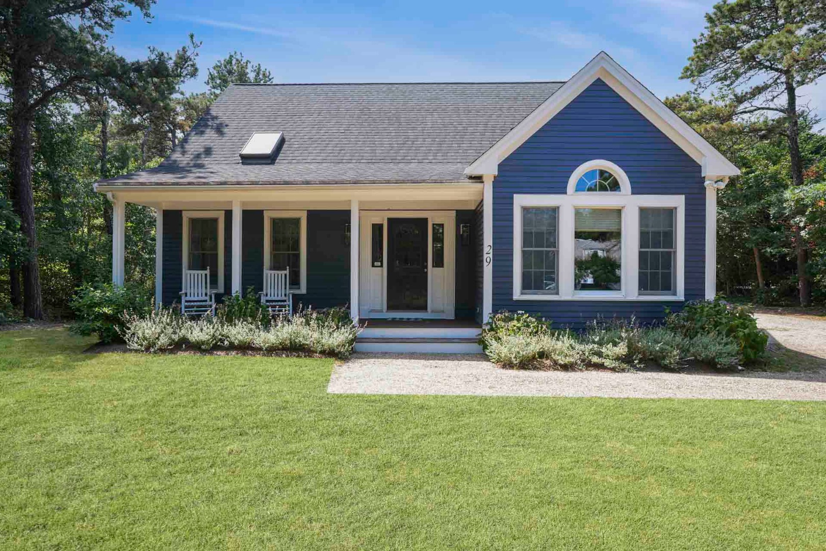 29 Pradas Way Edgartown, MA 02539 - Photo 2 of 30 front view of a house with a yard