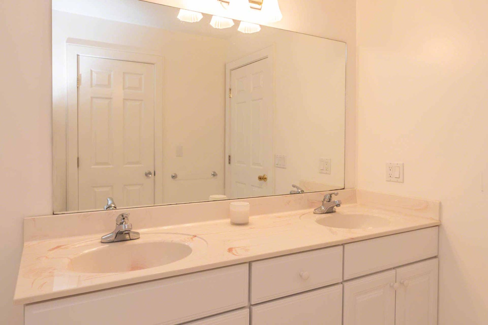 29 Pradas Way Edgartown, MA 02539 - Photo 23 of 30 a bathroom with a sink and a mirror