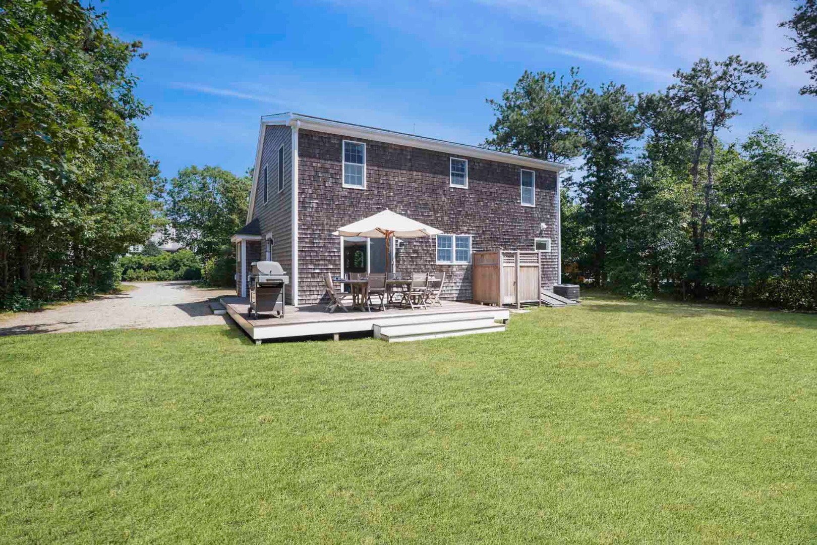 29 Pradas Way Edgartown, MA 02539 - Photo 26 of 30 a front view of a house with garden and a swimming pool