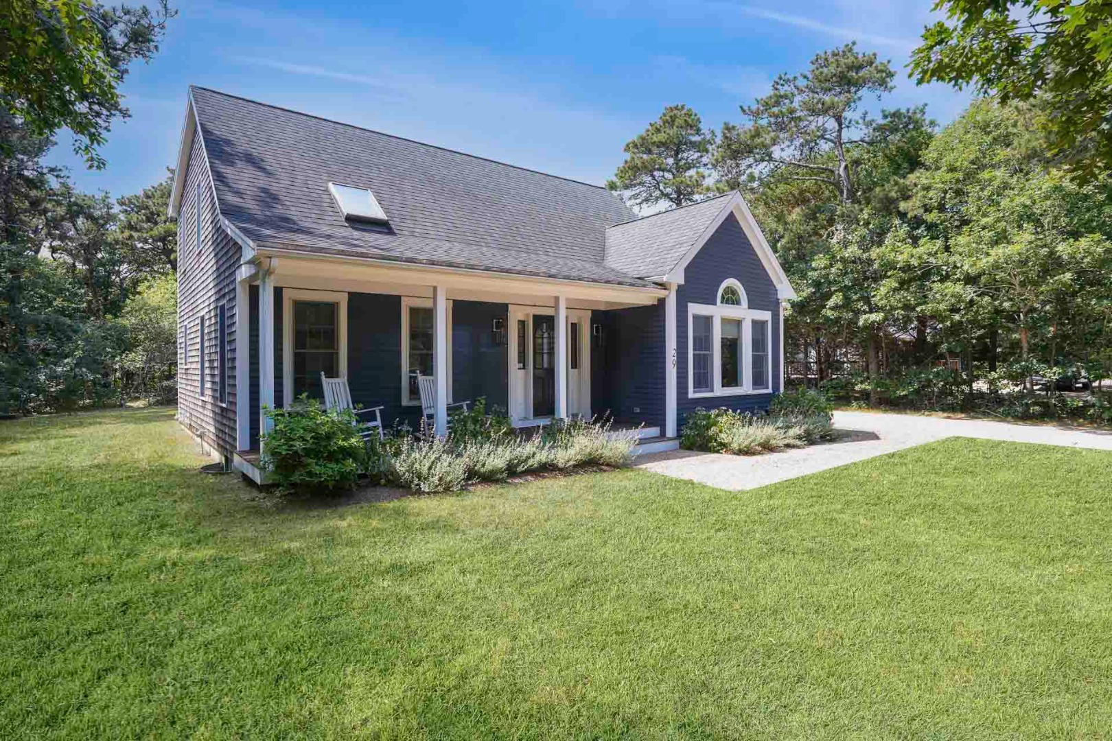 29 Pradas Way Edgartown, MA 02539 - Photo 30 of 30 a view of brick house with a yard and large trees