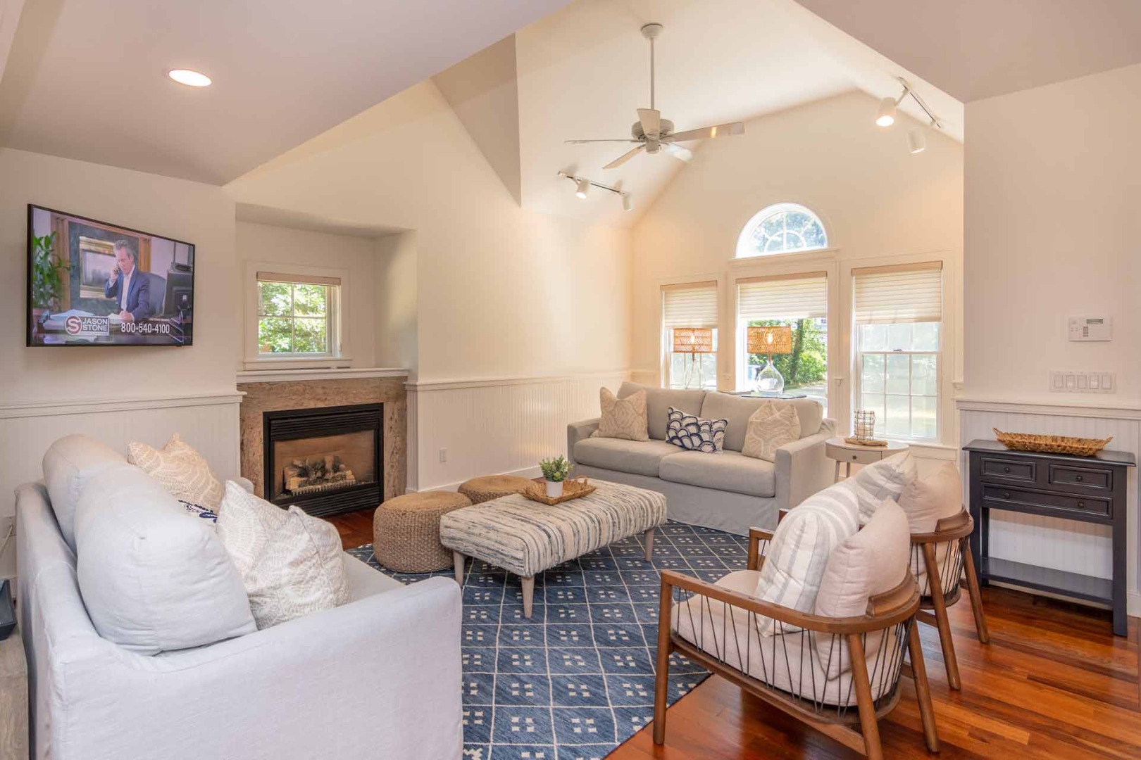 29 Pradas Way Edgartown, MA 02539 - Photo 3 of 30 a living room with furniture a fireplace and a large window