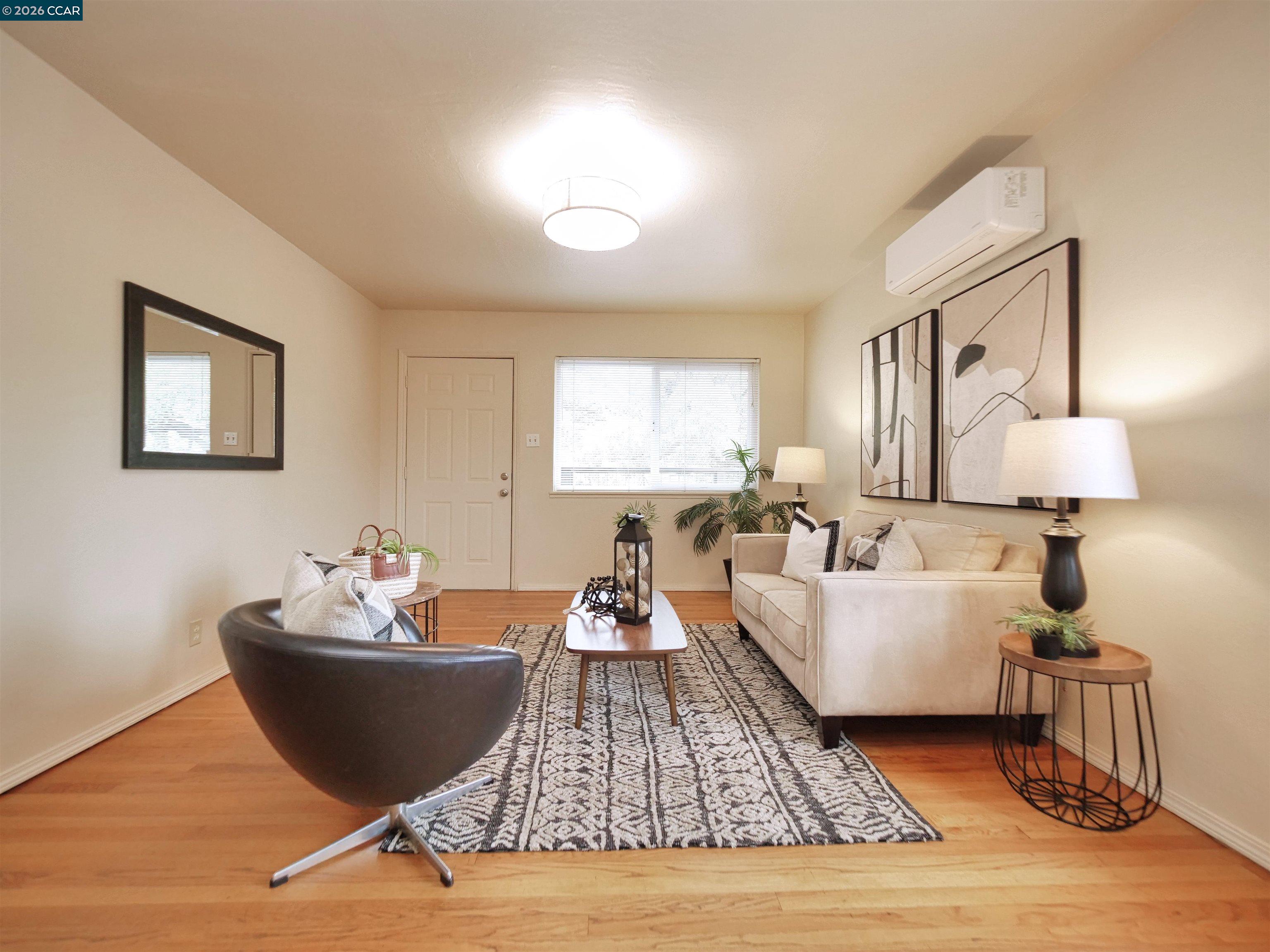 995 Virginia Street Berkeley, CA 94710 - Photo 17 of 59 a living room with furniture and wooden floor