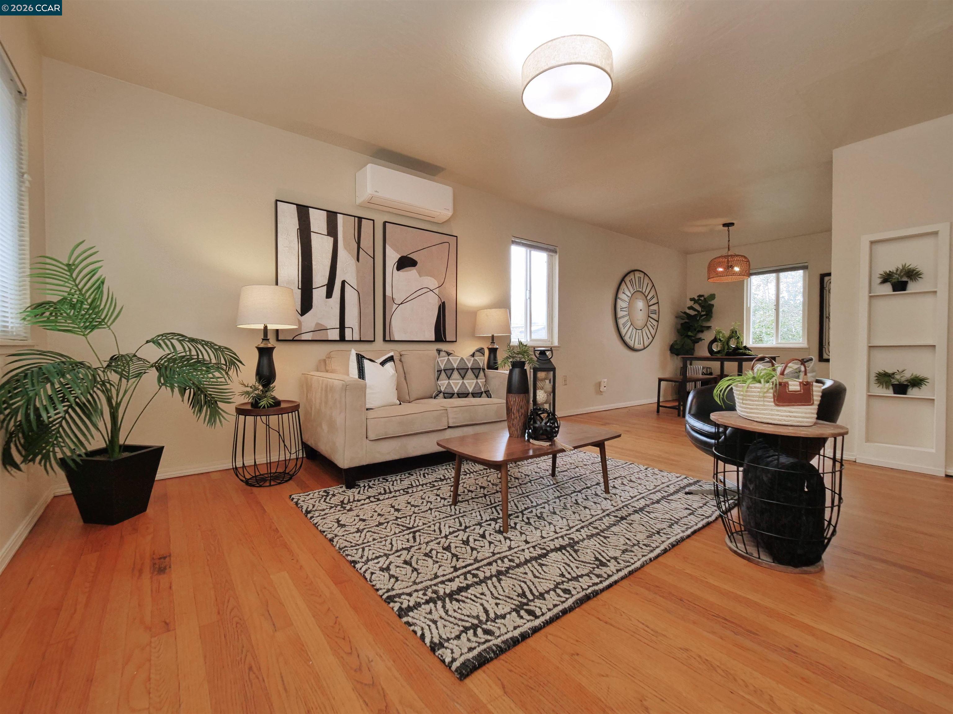 995 Virginia Street Berkeley, CA 94710 - Photo 19 of 59 a living room with furniture and a wooden floor