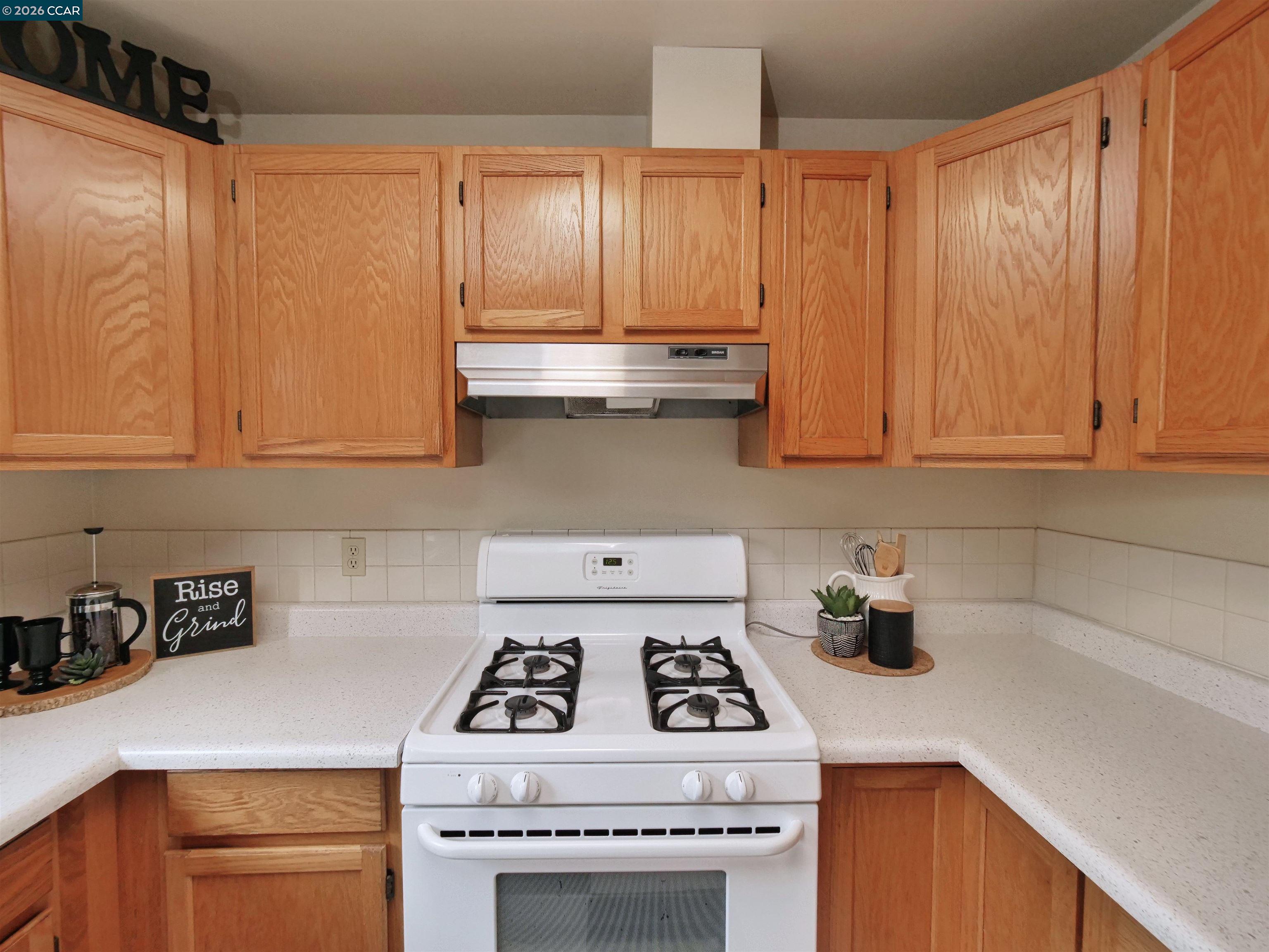 995 Virginia Street Berkeley, CA 94710 - Photo 24 of 59 a white stove top oven sitting inside of a kitchen