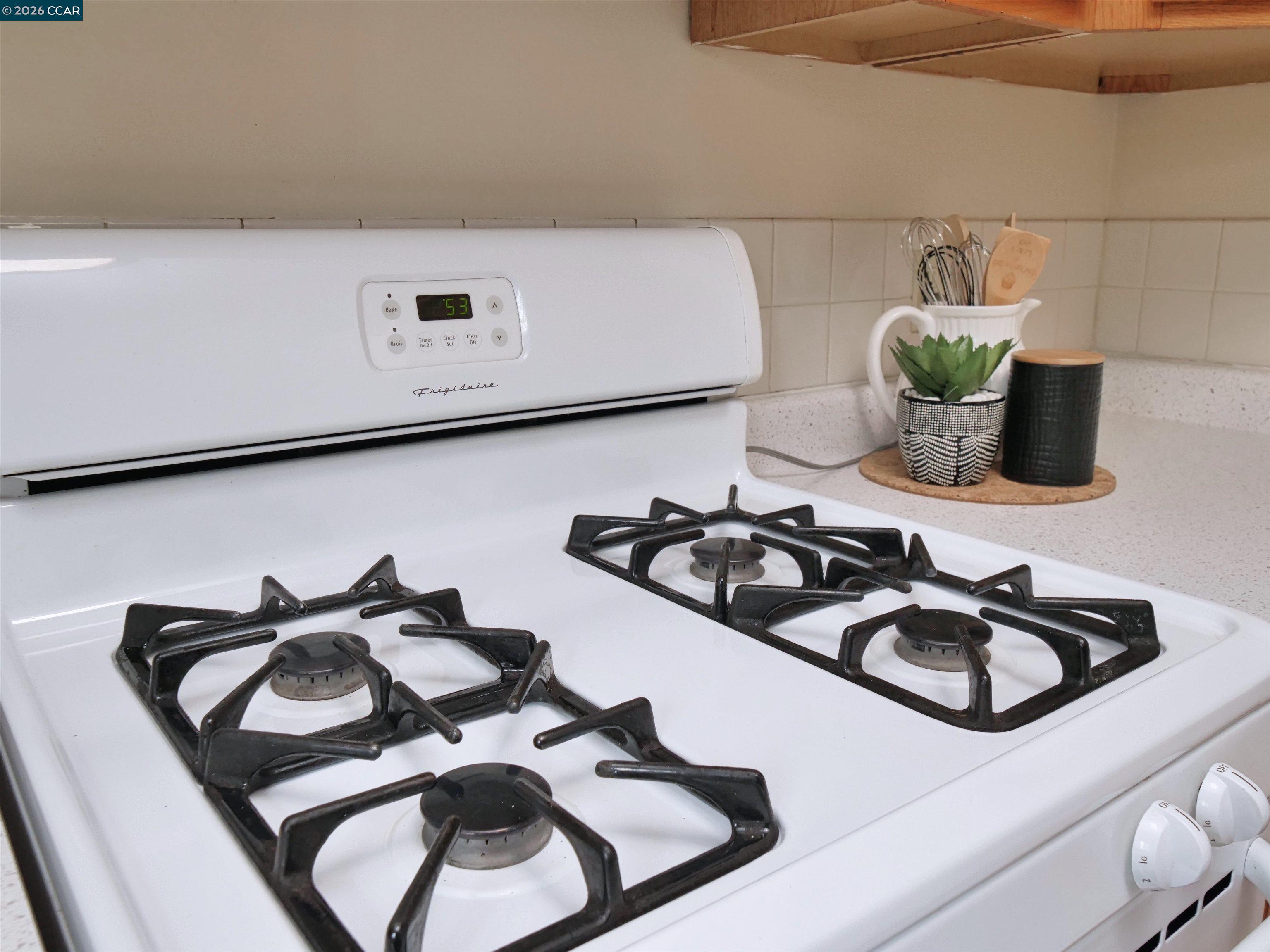 995 Virginia Street Berkeley, CA 94710 - Photo 25 of 59 a kitchen with a sink and a stove top oven