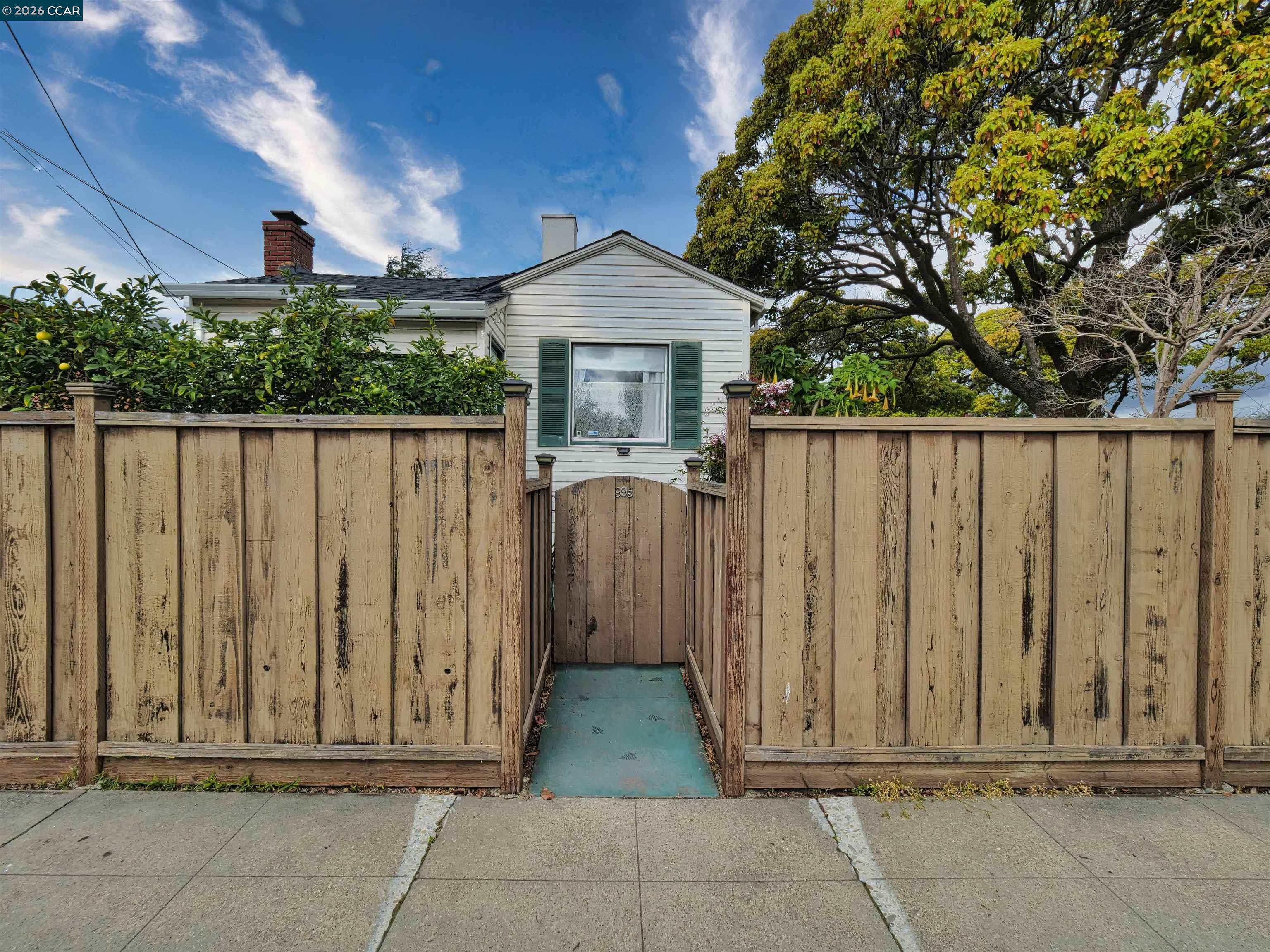 995 Virginia Street Berkeley, CA 94710 - Photo 3 of 59 a view of a house with wooden fence
