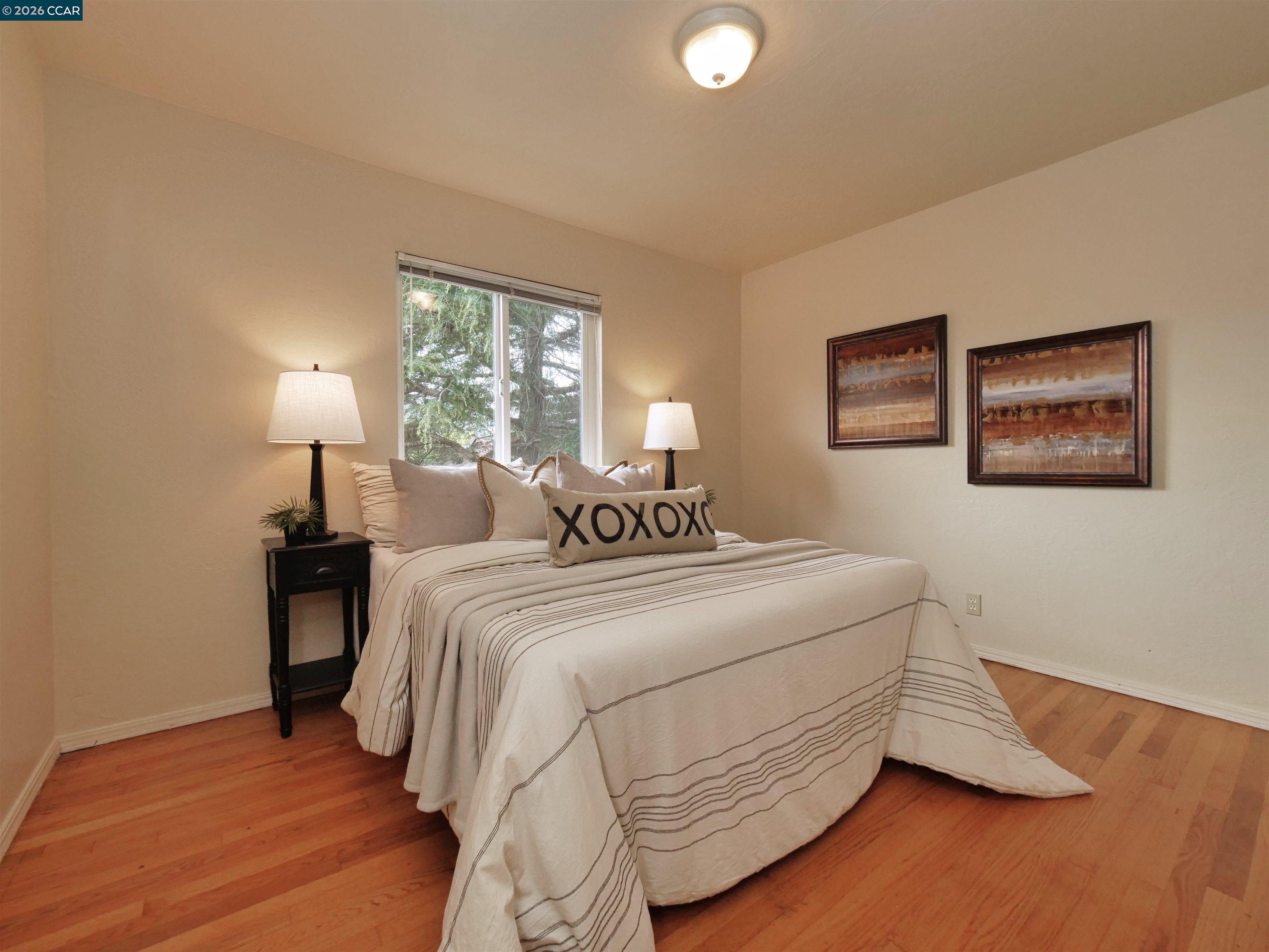 995 Virginia Street Berkeley, CA 94710 - Photo 31 of 59 a bedroom with bed and a night stand