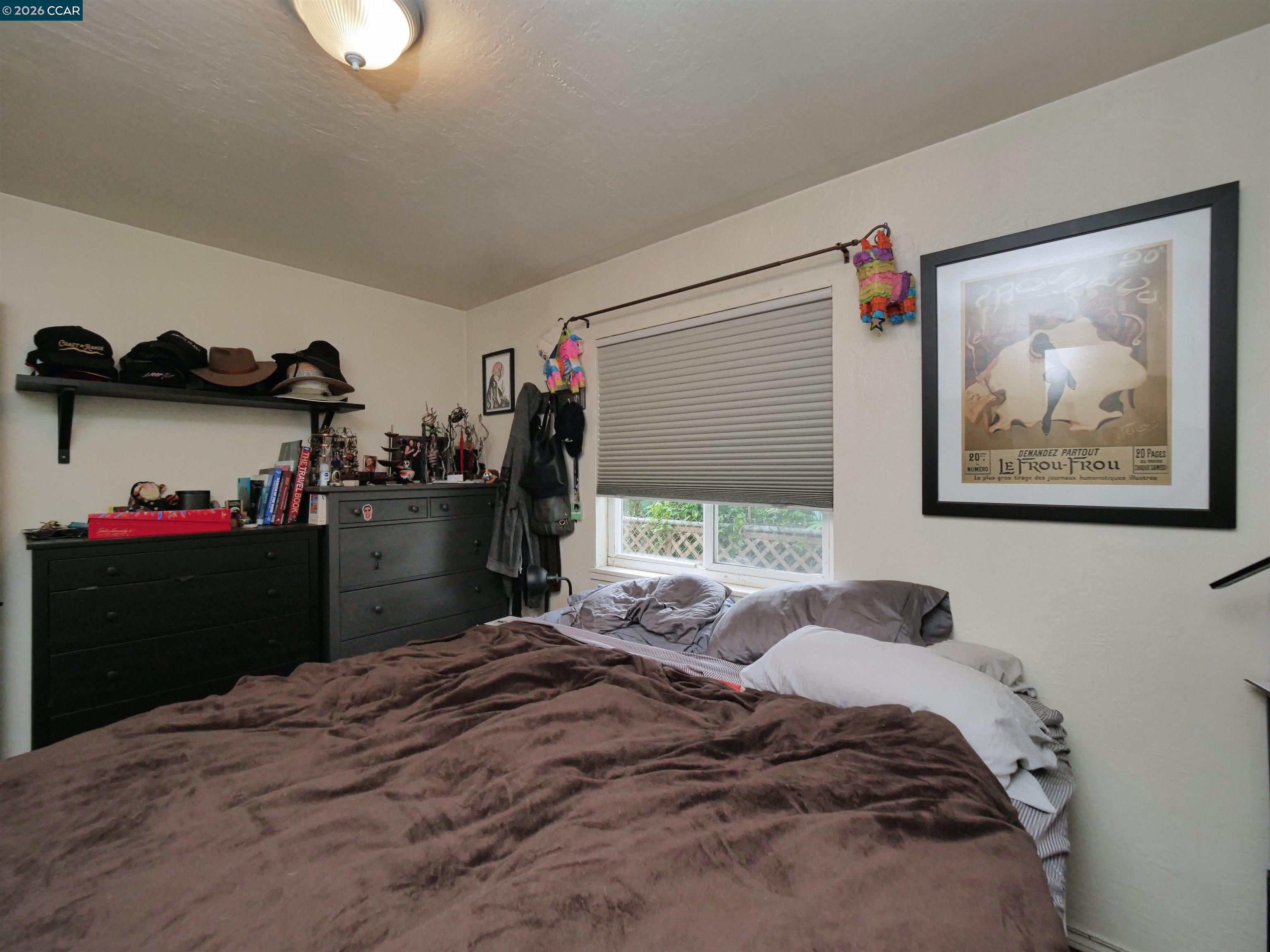 995 Virginia Street Berkeley, CA 94710 - Photo 40 of 59 a bedroom with a bed and a window