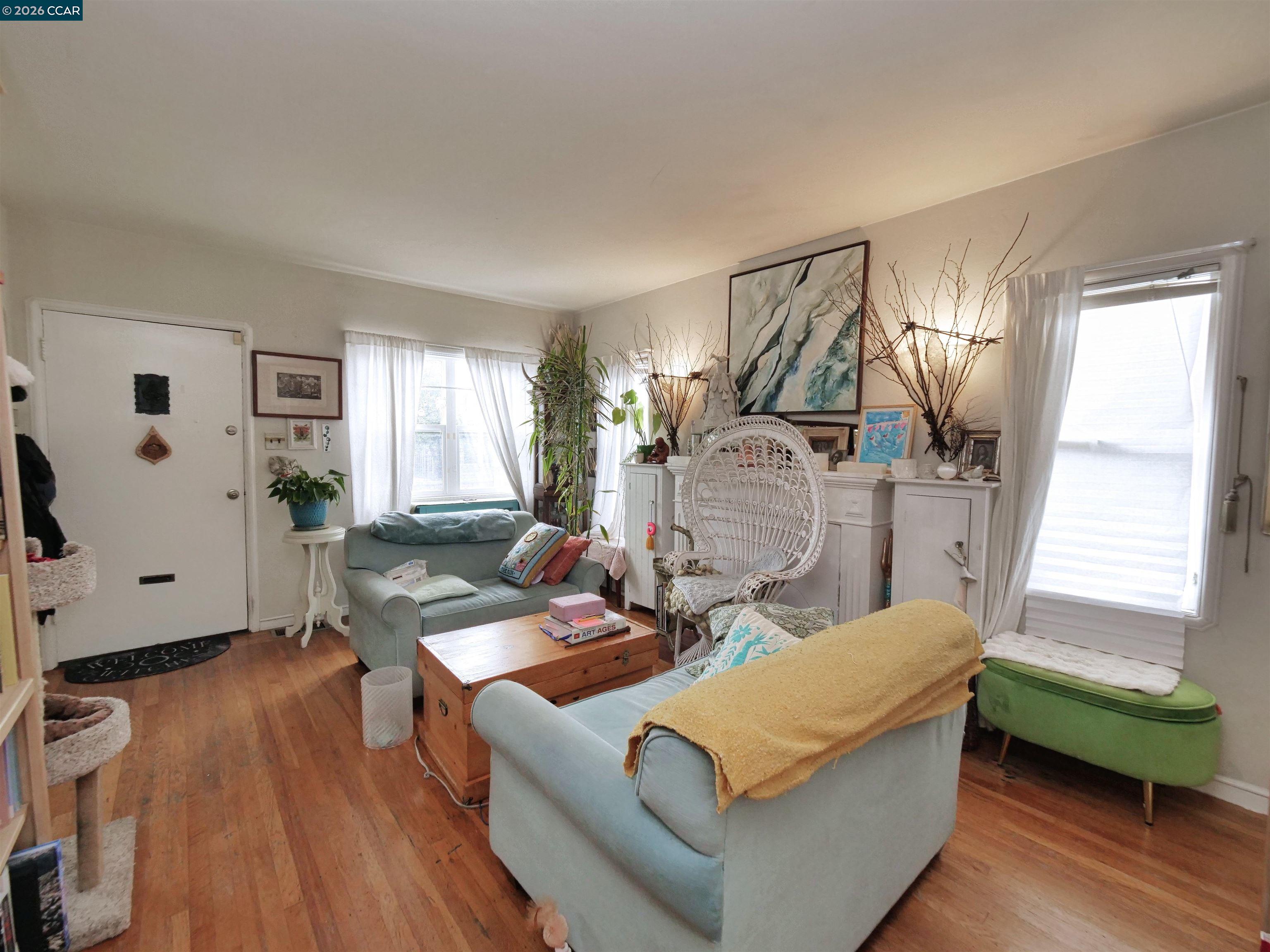 995 Virginia Street Berkeley, CA 94710 - Photo 47 of 59 a living room with furniture and a wooden floor