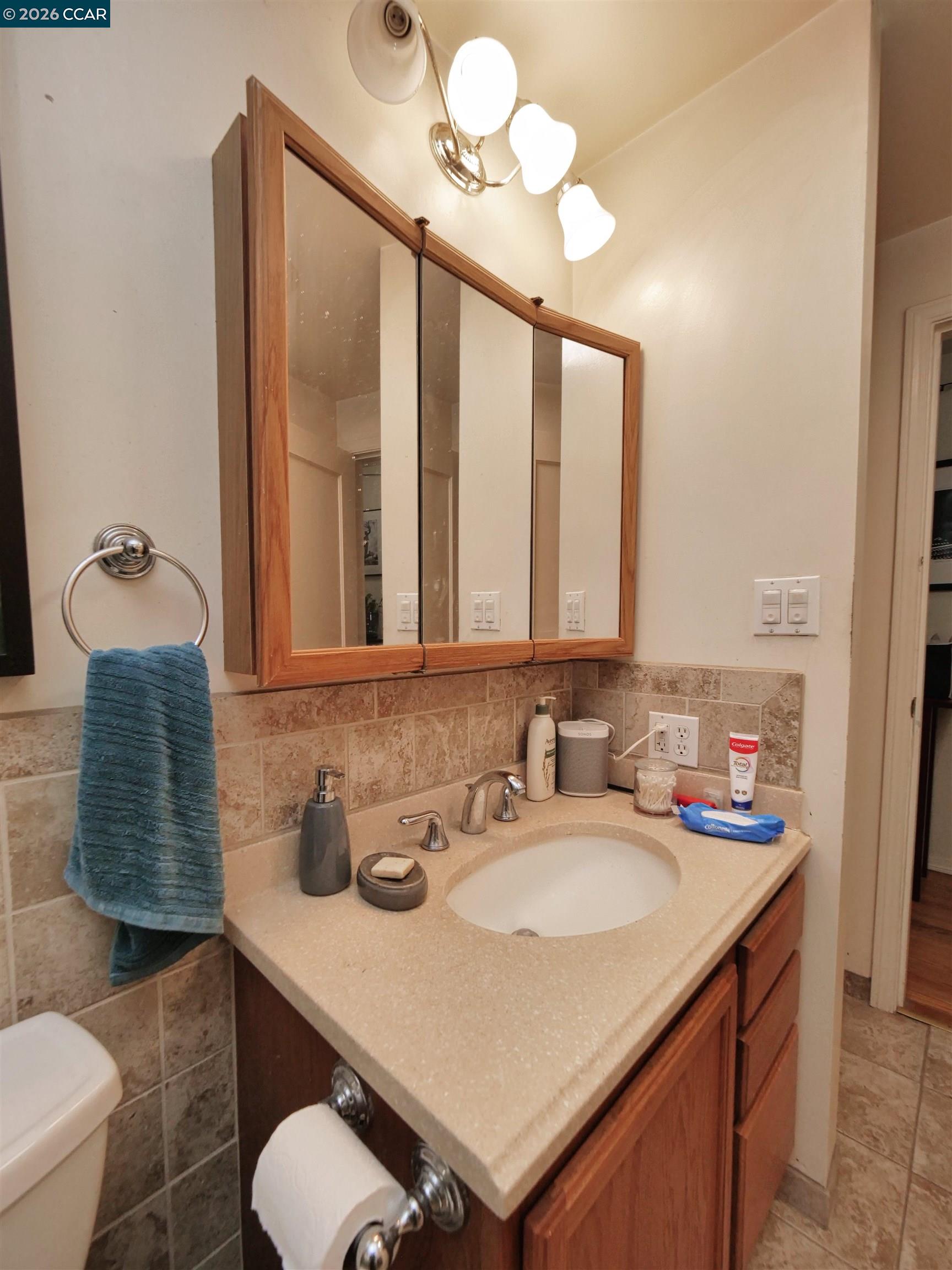 995 Virginia Street Berkeley, CA 94710 - Photo 54 of 59 a bathroom with a sink and a mirror