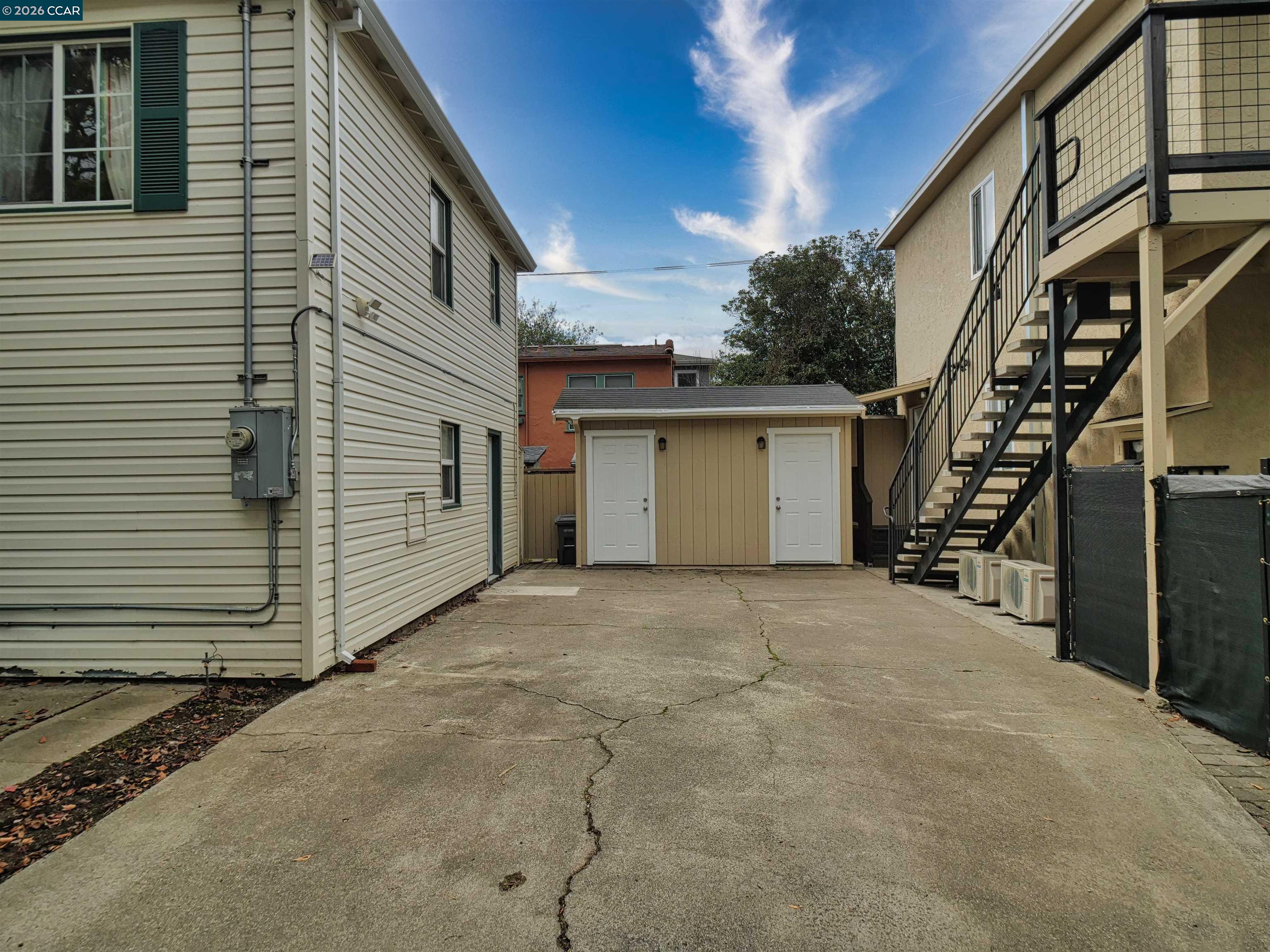 995 Virginia Street Berkeley, CA 94710 - Photo 8 of 59 a view of a house with stairs and a garage