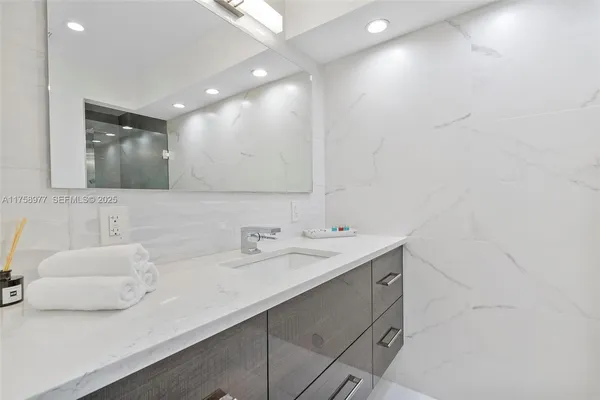 a bathroom with a sink and a mirror