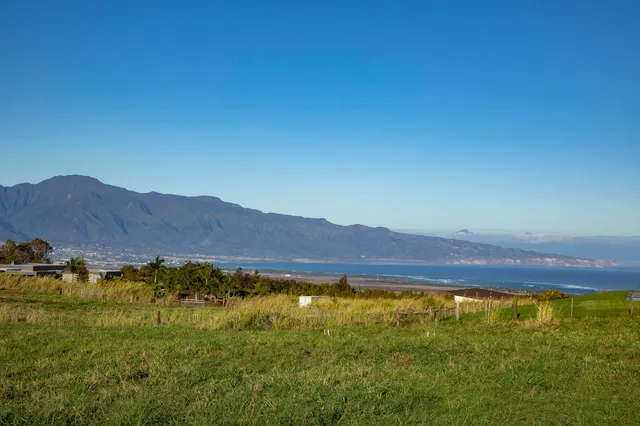 a view of an ocean from a mountain