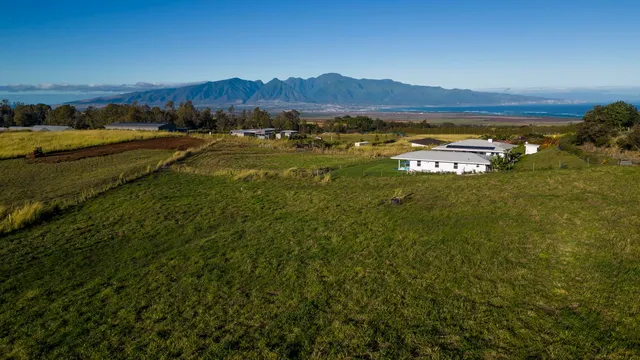 a view of an ocean and a mountain