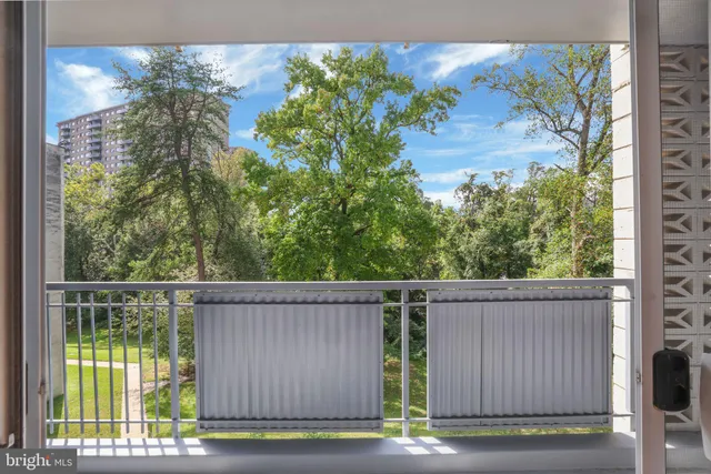 a view of a house with a tree in the background