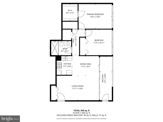 a picture of a bench in front of a wall