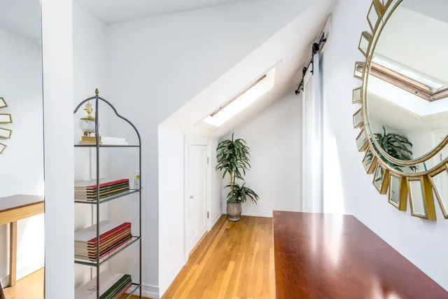 a view of an entryway with wooden floor