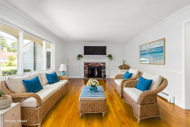 a living room with furniture fireplace and a flat screen tv
