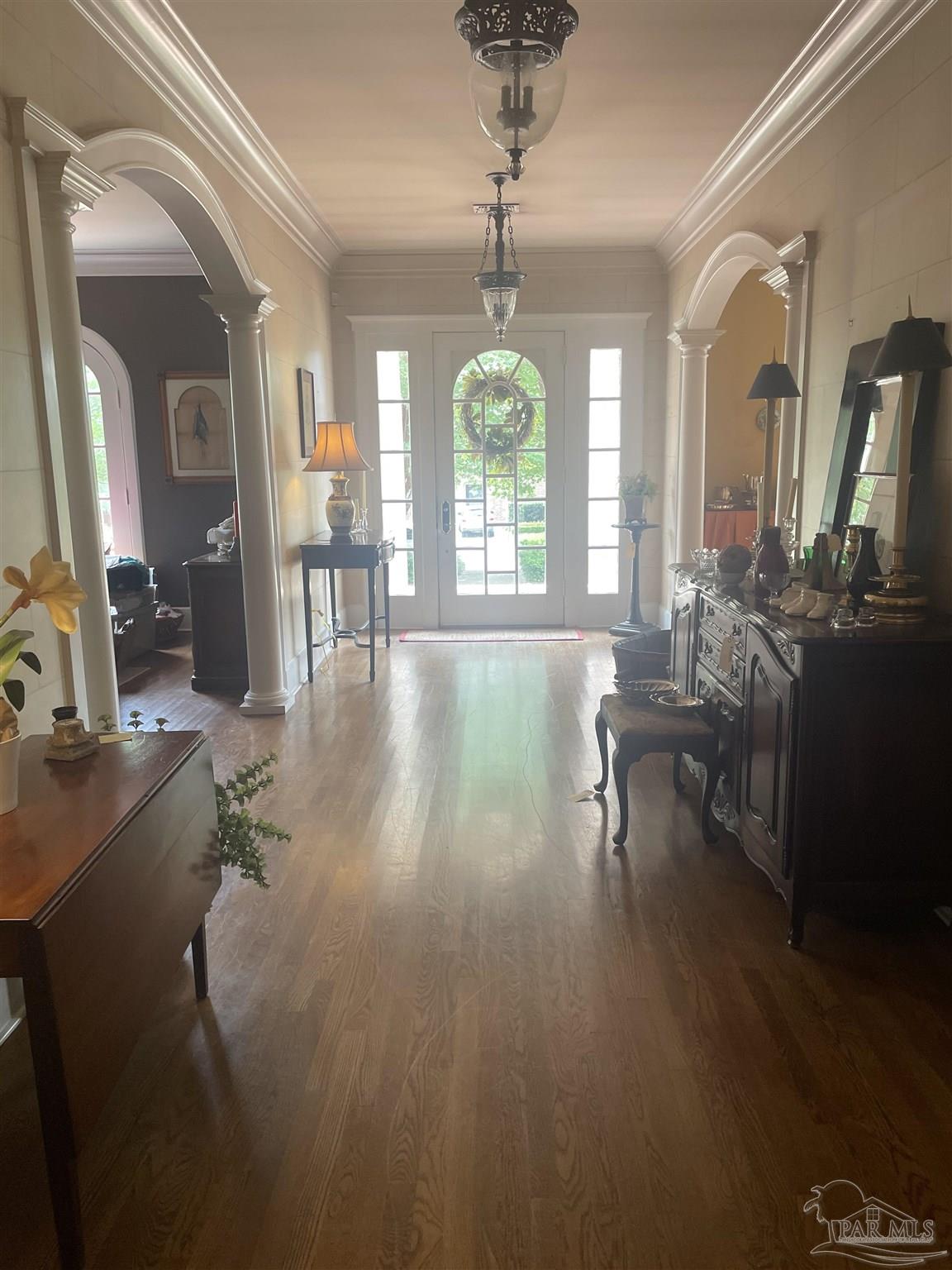 1904 East La Rua Street Pensacola, FL 32501 - Photo 3 of 14 a living room with furniture and a chandelier