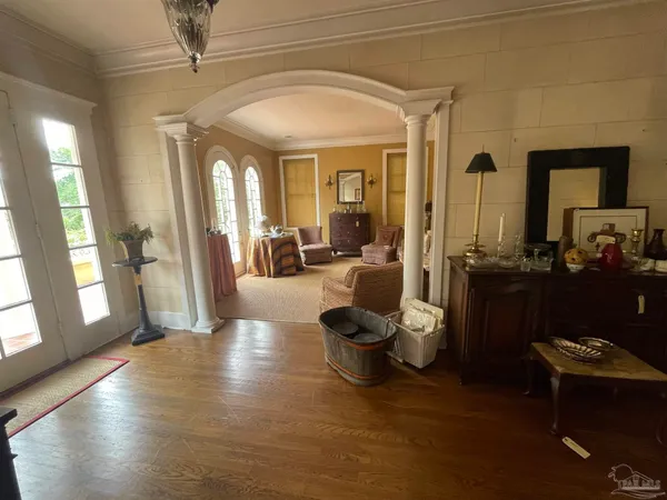 a living room with furniture and a large window