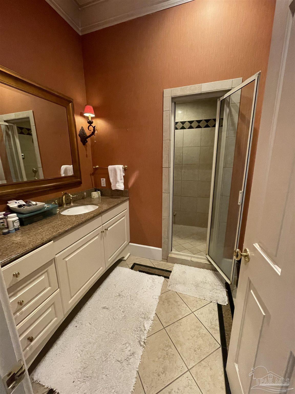 1904 East La Rua Street Pensacola, FL 32501 - Photo 7 of 14 a bedroom with a bed and furniture