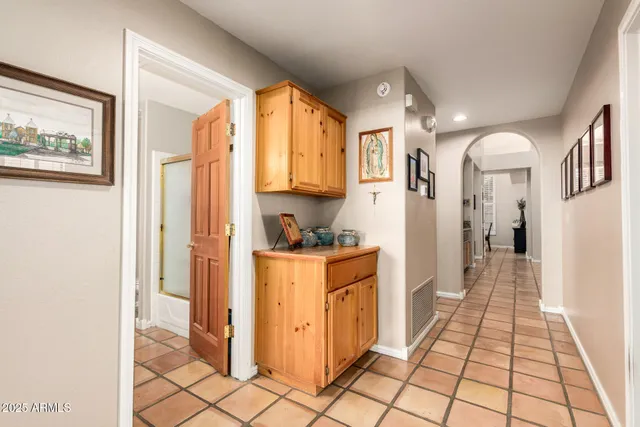 a bedroom with furniture and a flat screen tv