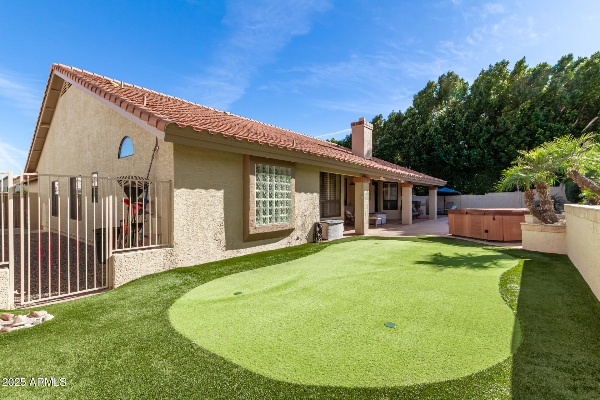 14044 South 33rd Way Phoenix, AZ 85044 - Photo 34 of 59 a view of a house with backyard sitting area and garden