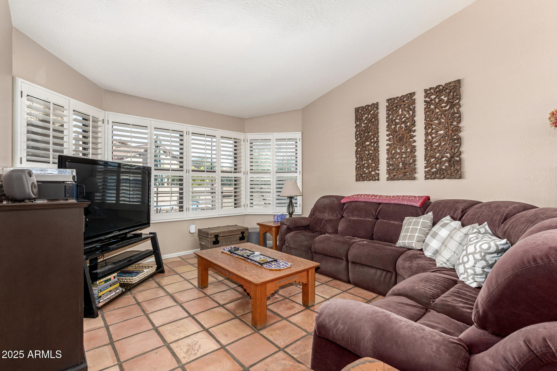 14044 South 33rd Way Phoenix, AZ 85044 - Photo 6 of 59 a living room with furniture and a floor to ceiling window