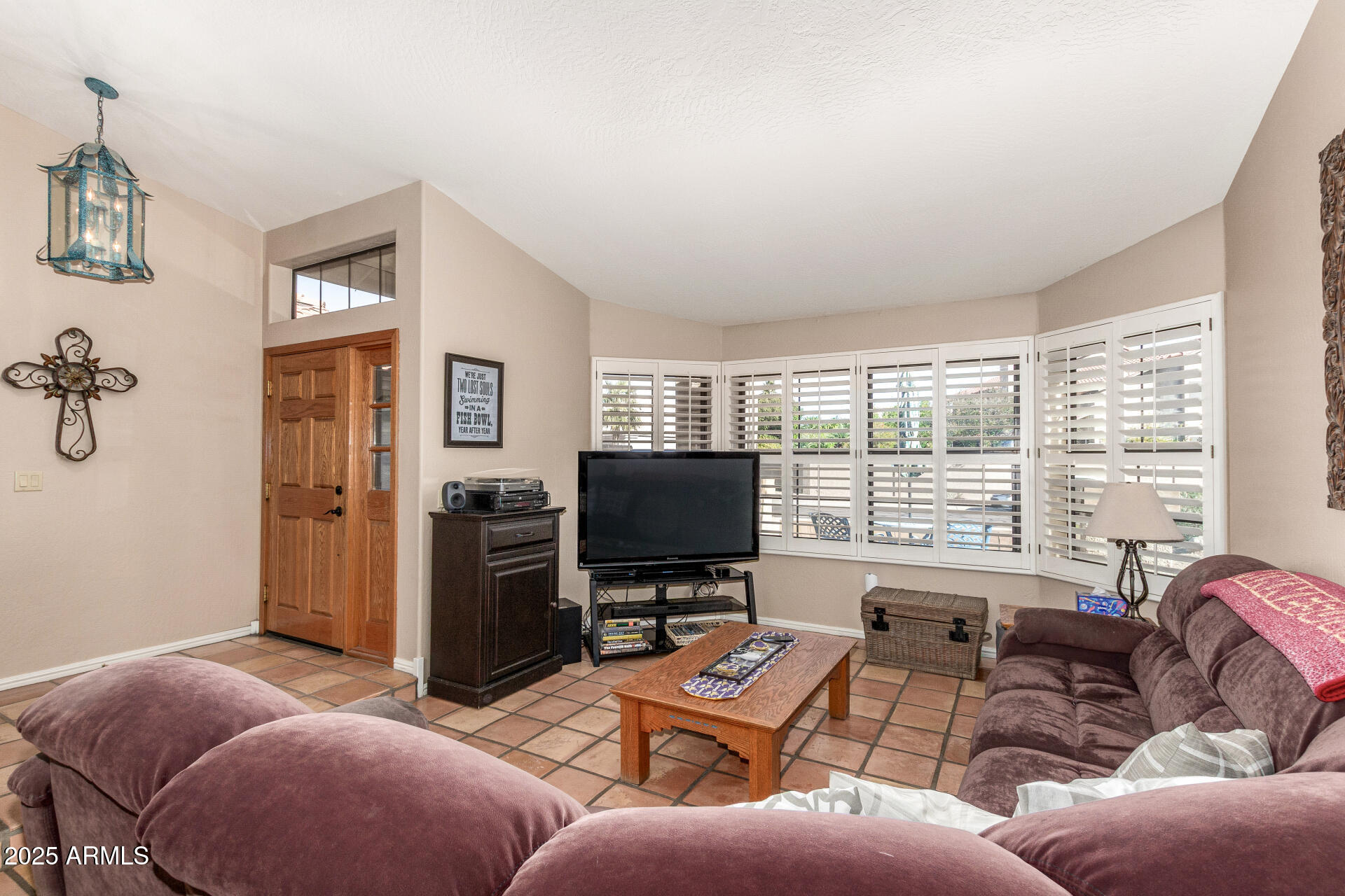 14044 South 33rd Way Phoenix, AZ 85044 - Photo 7 of 59 a living room with furniture and a flat screen tv