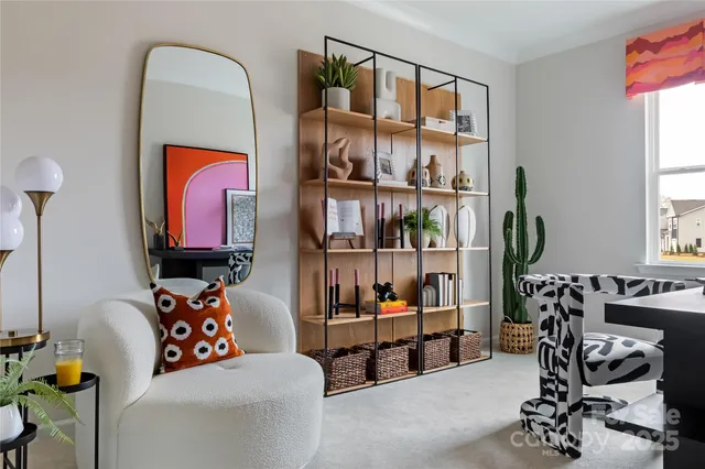a living room with furniture a window and a flat screen tv