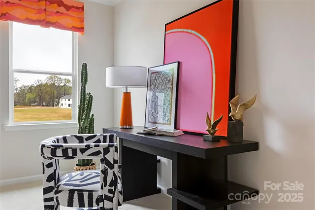 a dining room with table and chairs