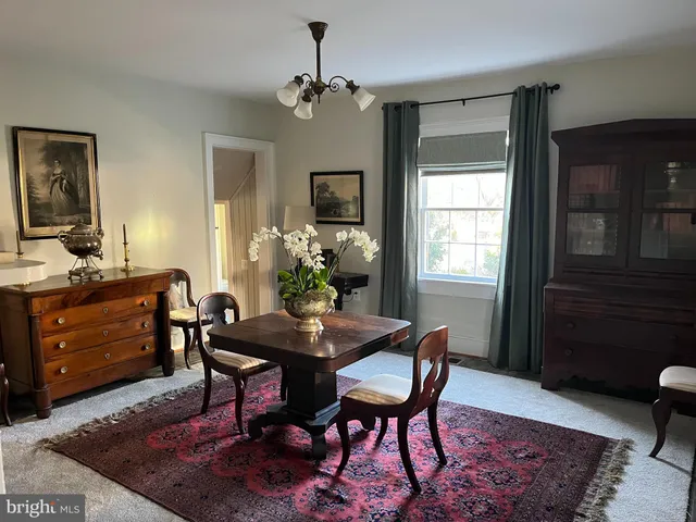 a living room with furniture rug and window