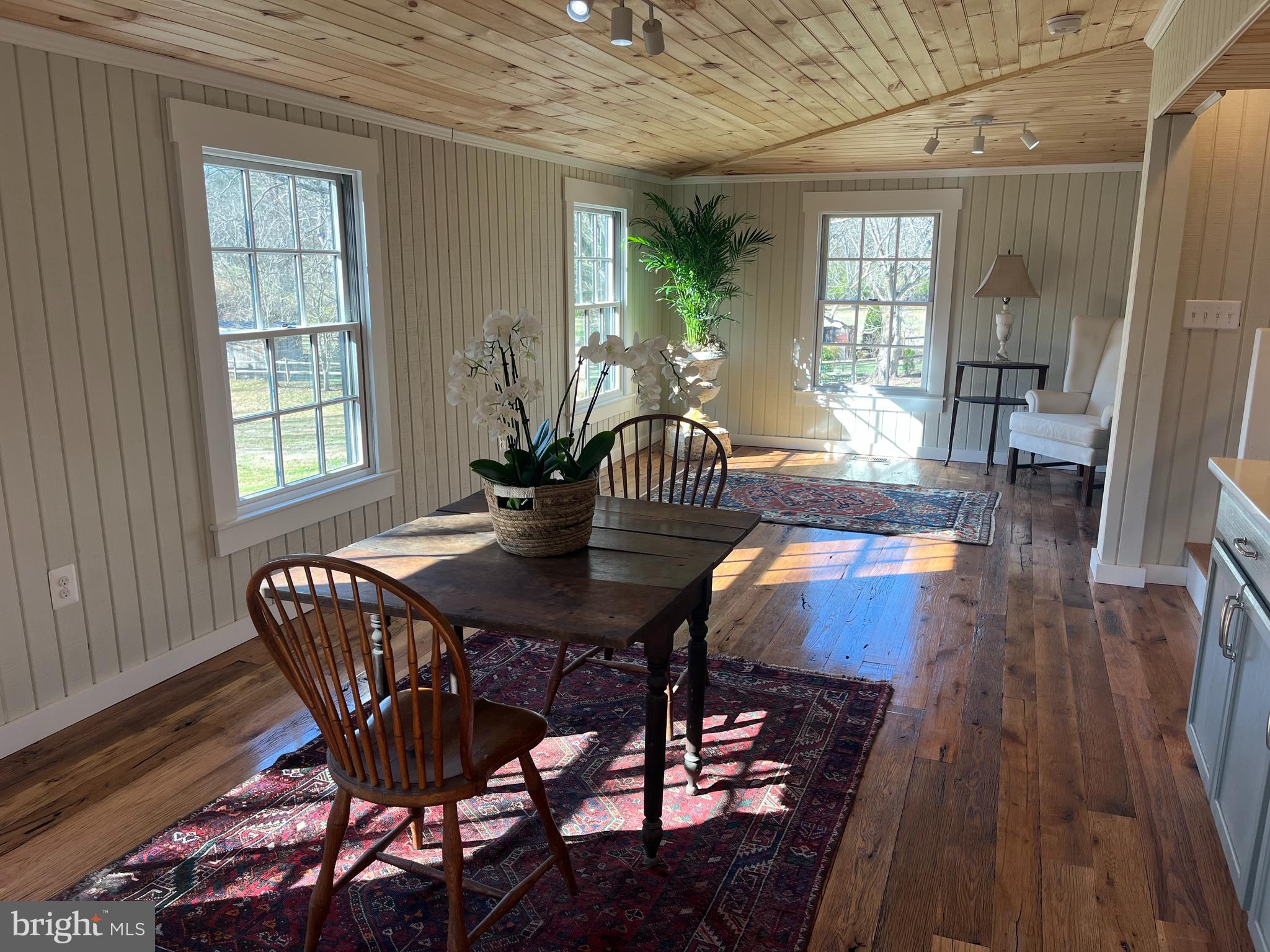 1690 Millwood Road Boyce, VA 22620 - Photo 16 of 44 a view of a dining room with furniture wooden floor and a chandelier