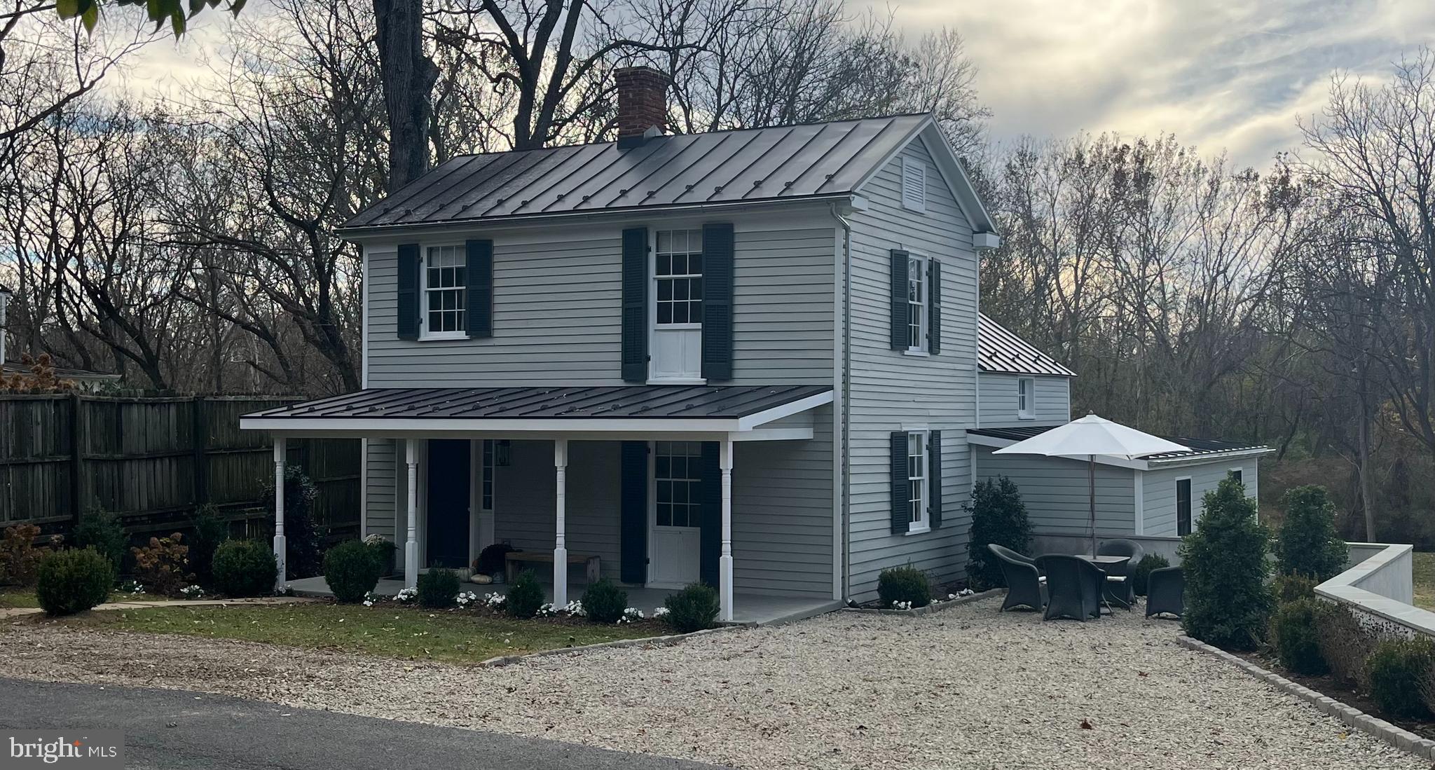 1690 Millwood Road Boyce, VA 22620 - Photo 2 of 44 a front view of a house with a yard and parking space