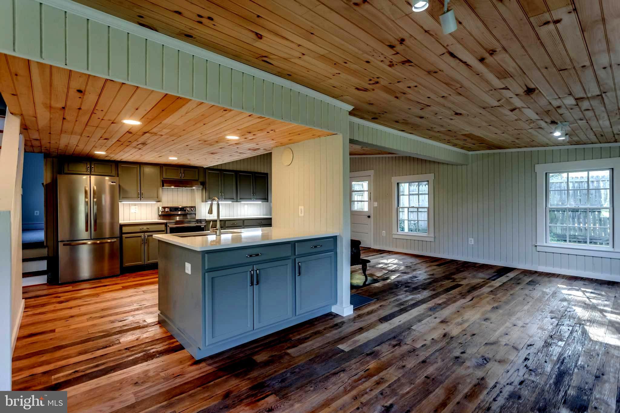 1690 Millwood Road Boyce, VA 22620 - Photo 24 of 44 a kitchen with stainless steel appliances granite countertop a sink stove and refrigerator