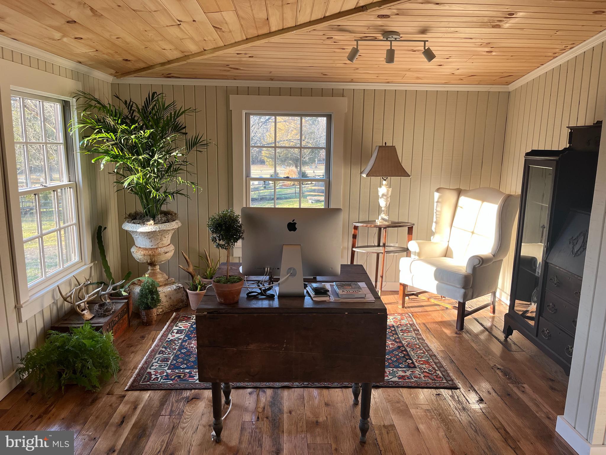 1690 Millwood Road Boyce, VA 22620 - Photo 25 of 44 a living room with furniture flowerpot and wooden floor