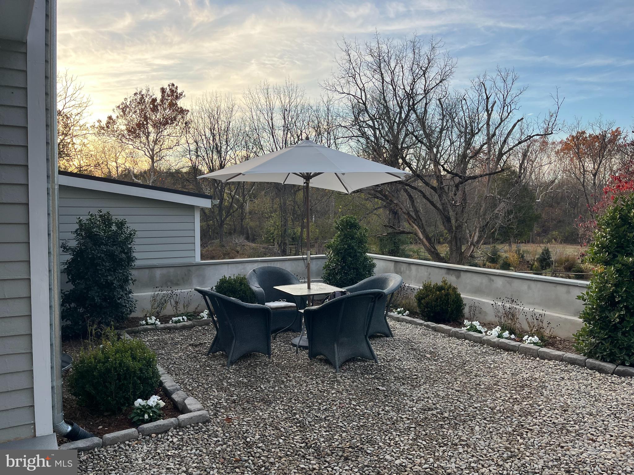 1690 Millwood Road Boyce, VA 22620 - Photo 43 of 44 a backyard of a house with table and chairs