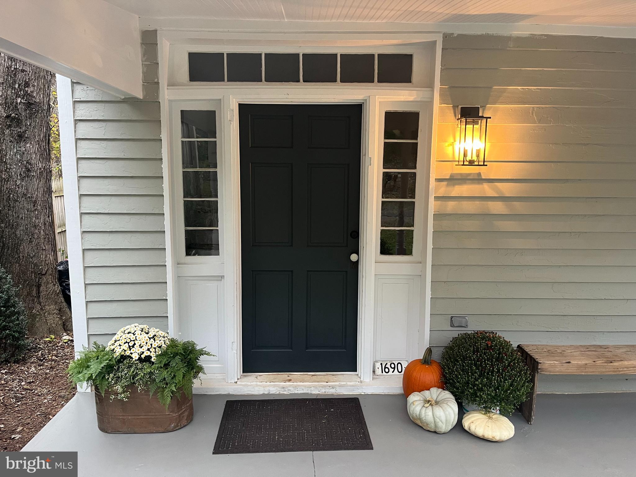 1690 Millwood Road Boyce, VA 22620 - Photo 6 of 44 a front view of a house with a potted plant