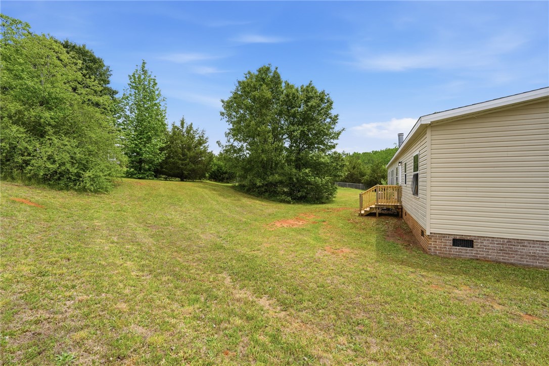 112 Sir Francis Drake Way Liberty, SC 29657 - Photo 11 of 42 This spacious yard offers ample outdoor living space and serene natural surroundings.