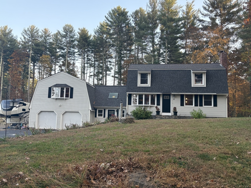 11 Potter Road Douglas, MA 01516 - Photo 1 of 41 a view of a big house with a big yard and large trees