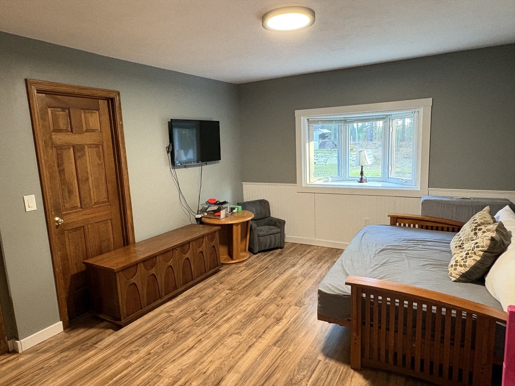 11 Potter Road Douglas, MA 01516 - Photo 13 of 41 a living room with furniture and a flat screen tv