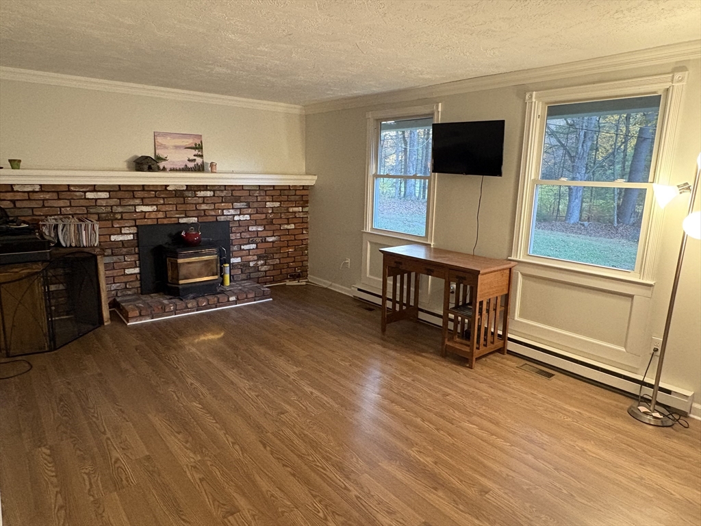 11 Potter Road Douglas, MA 01516 - Photo 24 of 41 a view of a livingroom with furniture wooden floor and window
