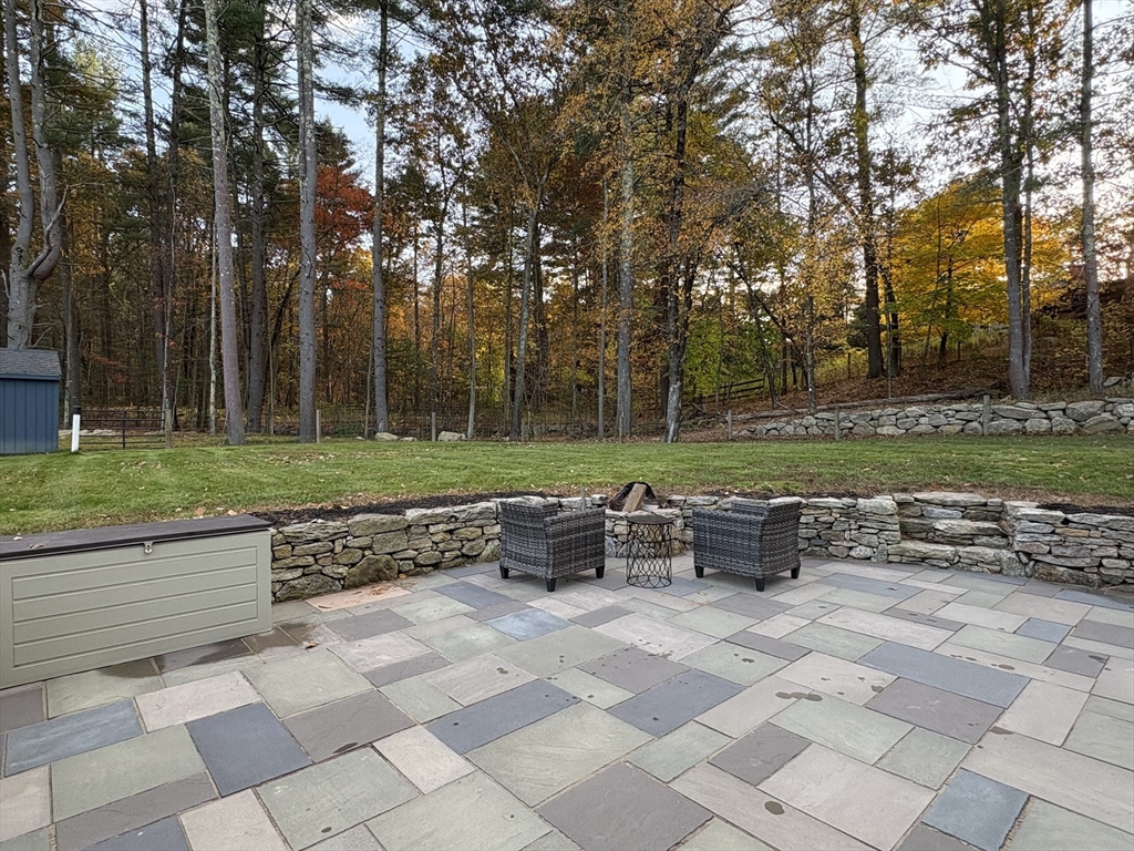 11 Potter Road Douglas, MA 01516 - Photo 33 of 41 a view of backyard with table and chairs and plants