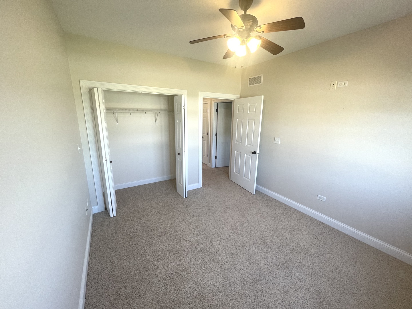 440 Edgebrook Drive Bourbonnais, IL 60914 - Photo 26 of 34 an empty room with closet and a chandelier fan