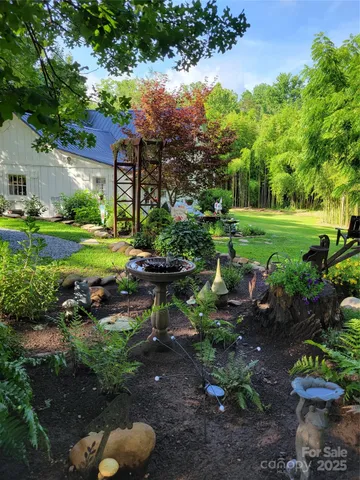 a view of a house with a yard and plants