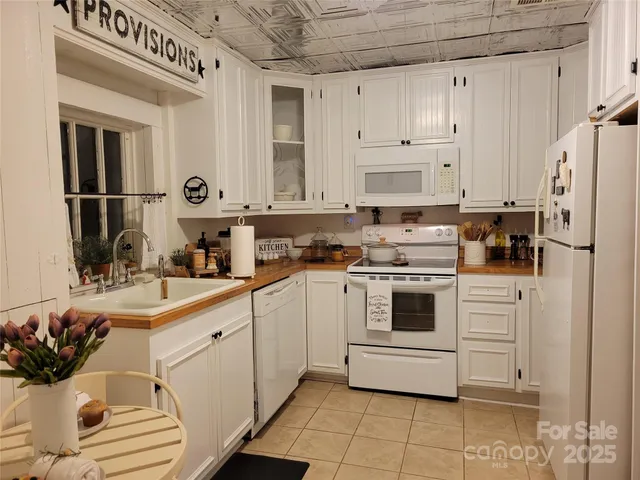 a front view of a house with outdoor seating space