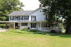 122 Upper Road Middletown, NY 10940 - Photo 1 of 1 a front view of a house with a yard table and chairs