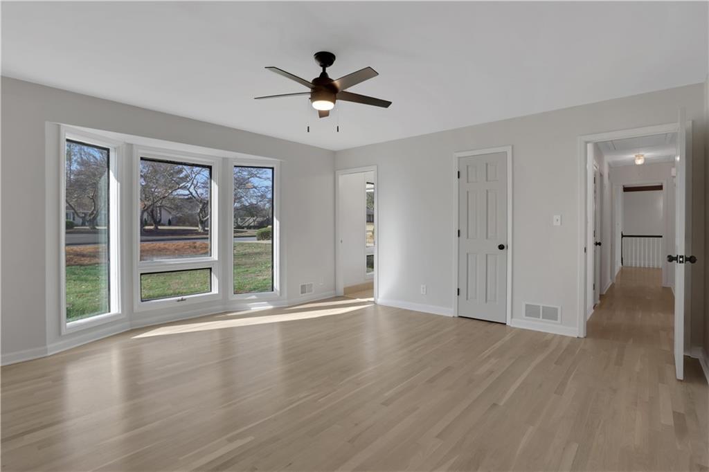 600 Rounsaville Road Roswell, GA 30076 - Photo 23 of 45 a view of an empty room with a window and wooden floor