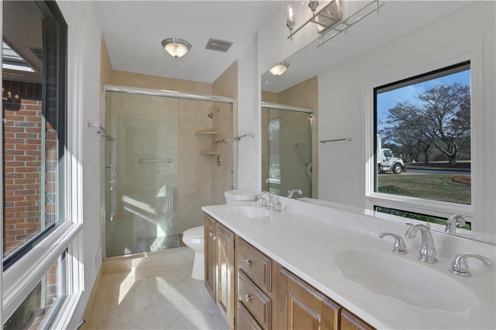 600 Rounsaville Road Roswell, GA 30076 - Photo 24 of 45 a bathroom with a double vanity sink mirror and double